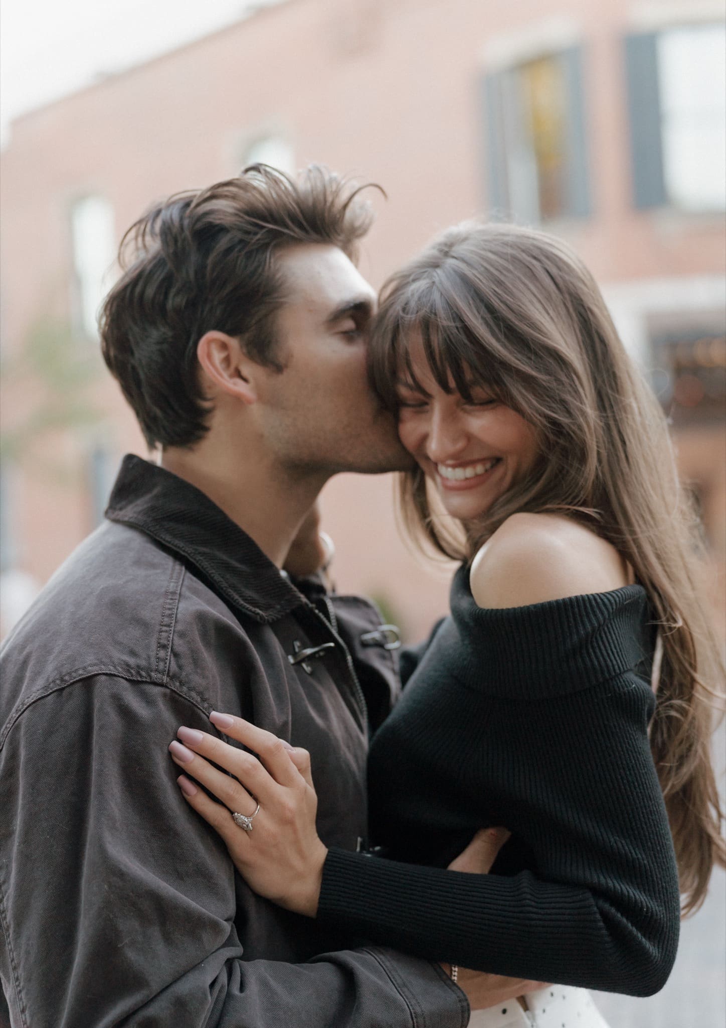 Candid close-up of an engaged couple embracing at golden hour, Columbus, Ohio couples photographer